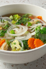 A view of a bowl of vegetable soup.
