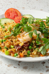 A view of a plate of combo fried rice.