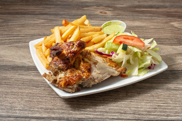 A view of a plate of quarter chicken.