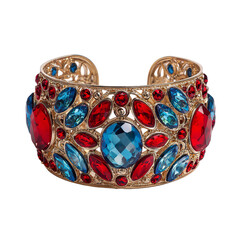 Gold cuff bracelet adorned with red and teal crystals. Ornate filigree design