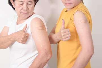 Adult and Elderly Woman with bandage after received vaccine. Vaccination and Immunization for...