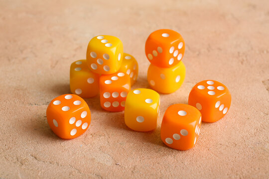 Different dices on beige background