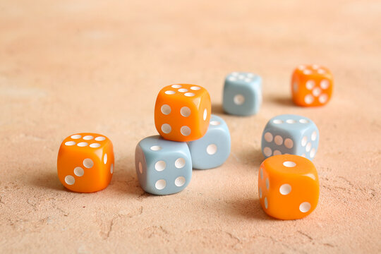 Different dices on beige background