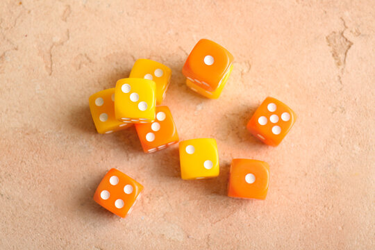 Different dices on beige background