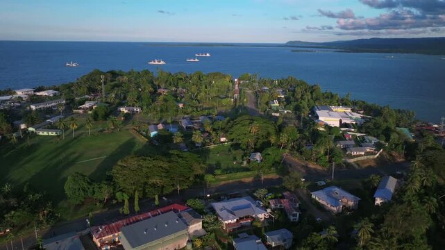 Sunset golden hour container ships boats Wewak Hill Wewak Papua New Guinea aerial drone coastal town seawall Boram road Memorial Drive Sundaun Market Dogreto Bay Cape Wom Bismark Sea circle left