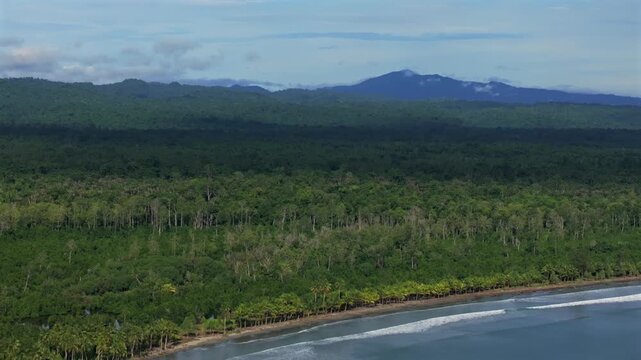 Wewak waves sea harbour view Wewak Hill Cape Wom Dogreto aerial drone Papua New Guinea Pacific Ocean pristine remote tropical beach coastline sunny dry season blue sky morning mountains backwards