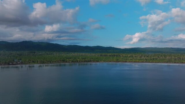 Wewak sea harbour view Wewak Hill Cape Wom Dogreto aerial drone Papua New Guinea Pacific Ocean pristine remote tropical beach coastline sunny dry season blue sky morning mountain pass forward upwards