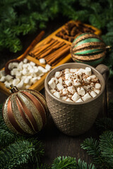 Cup of hot chocolate with marshmallow. Hot winter drinks in christmas environment. Cozy winter mood.