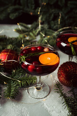 Cocktail based on gin with cranberry juice in christmas decorations. Cocktails for christmas party. 