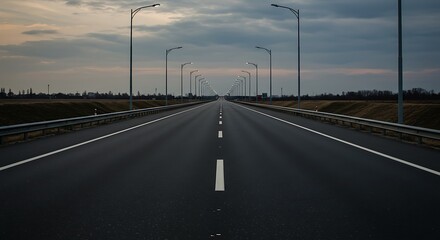 Empty highway perspective view under cloudy sky at twilight