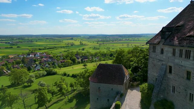 4K Aerial Drone Video Flyby of the Farmland Surrounding the Beautiful Colmberg Castle near Ansbach, Germany in Bavaria