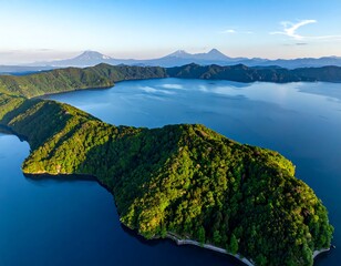 Serene lake with forested islands and distant mountains
