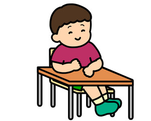 机に座る男の子