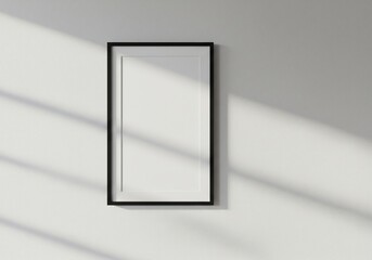 Elegant Vertical Black Frame Mockup with Sunlight Shadows on Textured White Wall