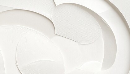 Swirls of thick, opaque white substance create abstract, textured pattern