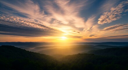 Obraz premium Radiant Golden Sunset Over Forested Mountain Ridges
