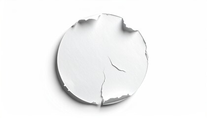 Circular tear in white paper reveals a shadowed base, isolated on a white background