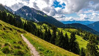 Scenic view of a mountain range with a hiking trail, green meadows, and forests under a cloudy sky. Distant mountains visible