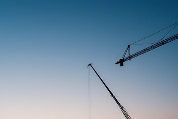 Obraz premium construction crane against blue sky