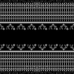 Elegant floral pattern with intricate designs in black and white, featuring roses and decorative elements, perfect for textiles or backgrounds