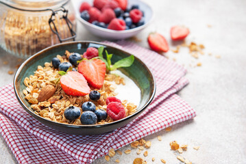 Granola bowl with fresh berries yogurt and nuts