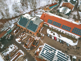 Renewable energy industrial zone with snow-covered roofs