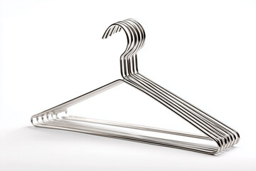 Stack of stainless steel clothes hangers, isolated on white background.