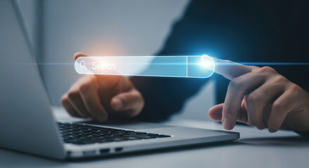 Person Activating Search Bar on Laptop Screen Representing Digital Exploration and Information Access in a Modern Technological Context