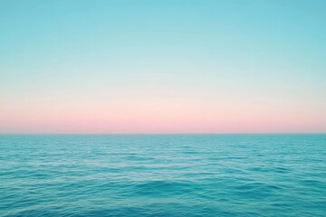 Obraz premium Open ocean view with pastel sky at sunset