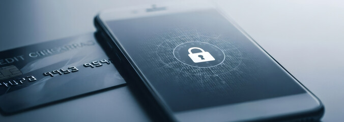 Smartphone with padlock icon on screen near credit card. Personal data protection and cyber security concept.