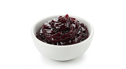A small white bowl filled with dark purple jam or preserves on a white background.