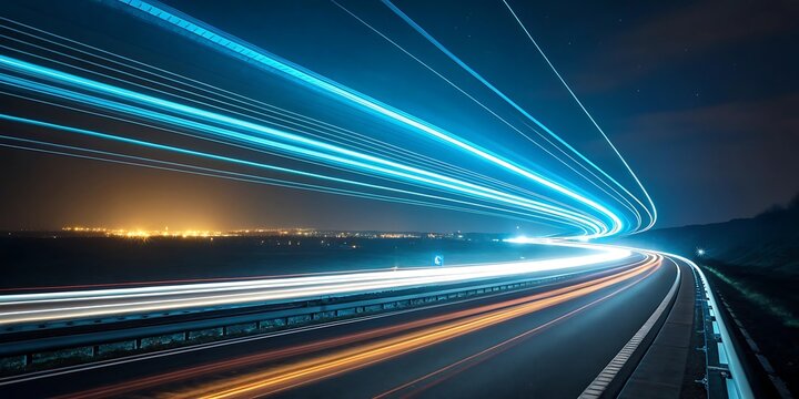 Streaks of light from moving vehicles create a mesmerizing abstract pattern on a highway at night conveying speed and motion
