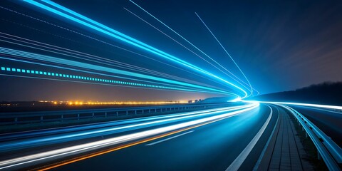 Obraz premium Streaks of vibrant blue and white light illuminate a dark highway at night creating a sense of speed and futuristic motion