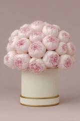 Beautiful romantic arrangement of pink peonies in an elegant white pot on a soft pastel background. Valentine's Day