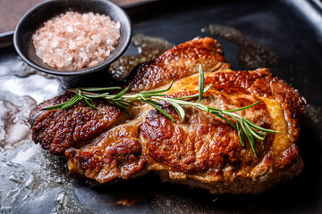Grilled beef steak with rosemary and pink salt