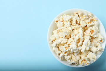 popcorn on a blue background top view
