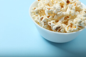 popcorn on a blue background top view
