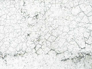 A wall with cracks and holes in it