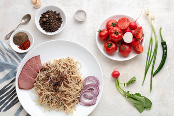 Uzbek food naryn with chopped dough and horse meat. Served with vegetables and spices. Flatlay view.Uzbekistan, Tashkent