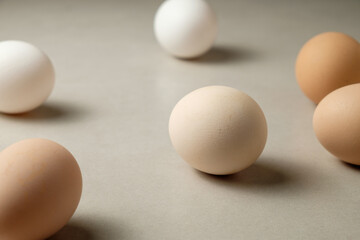 Variety of eggs on a simple surface showcasing natural colors and shapes