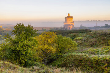 Abandoned church of Michael the Archangel in morning mist, Tula region