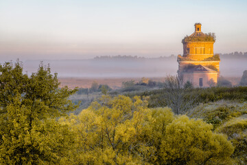 Abandoned church of Michael the Archangel in morning mist, Tula region