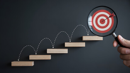 Steps to success with target in magnifying glass concept