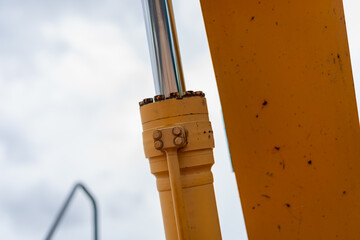 Hydraulic cylinder action construction equipment outdoor site industrial close-up perspective