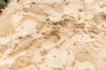 Sand pile close-up construction site textured material urban environment detailed perspective