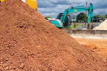 Excavation site action construction zone earth material urban environment ground level heavy machinery use