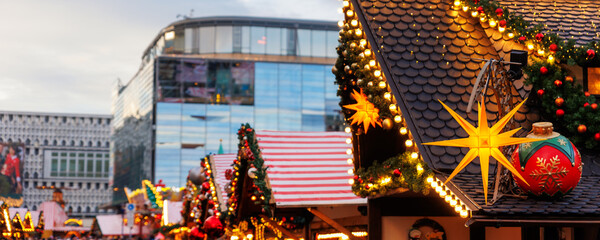 Beautiful traditional German Christmas Market square in city center many carousel Christmas tree light and decoration. Christmas and new year celebration season. Advent festive New year fair