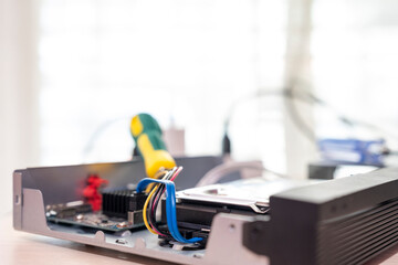 Repairing a wireless CCTV camera on a black background