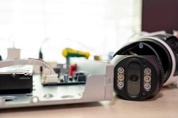 Repairing a wireless CCTV camera on a black background