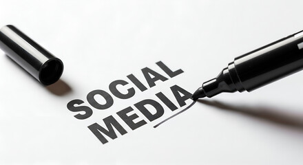 Emphasizing Social Media: Black marker underlining bold text on white paper, illustrating digital marketing and online communication.